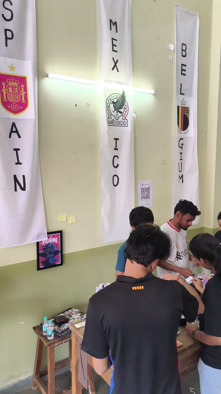 Students crowding a Stix N Vibes stall, picking stickers and posters
