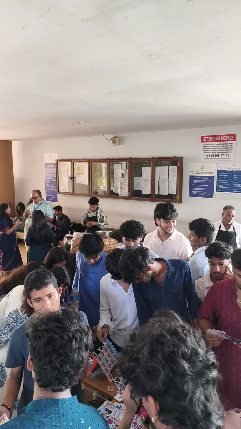 Students crowding around a Stix N Vibes sticker stall at a college in Goa